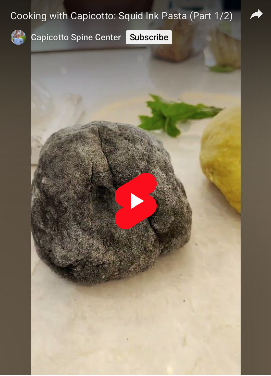 A ball of squid ink pasta dough, or black pasta dough.